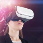 A woman wearing a VR headset using hands-free accessibility features to navigate a virtual simulation through gaze tracking