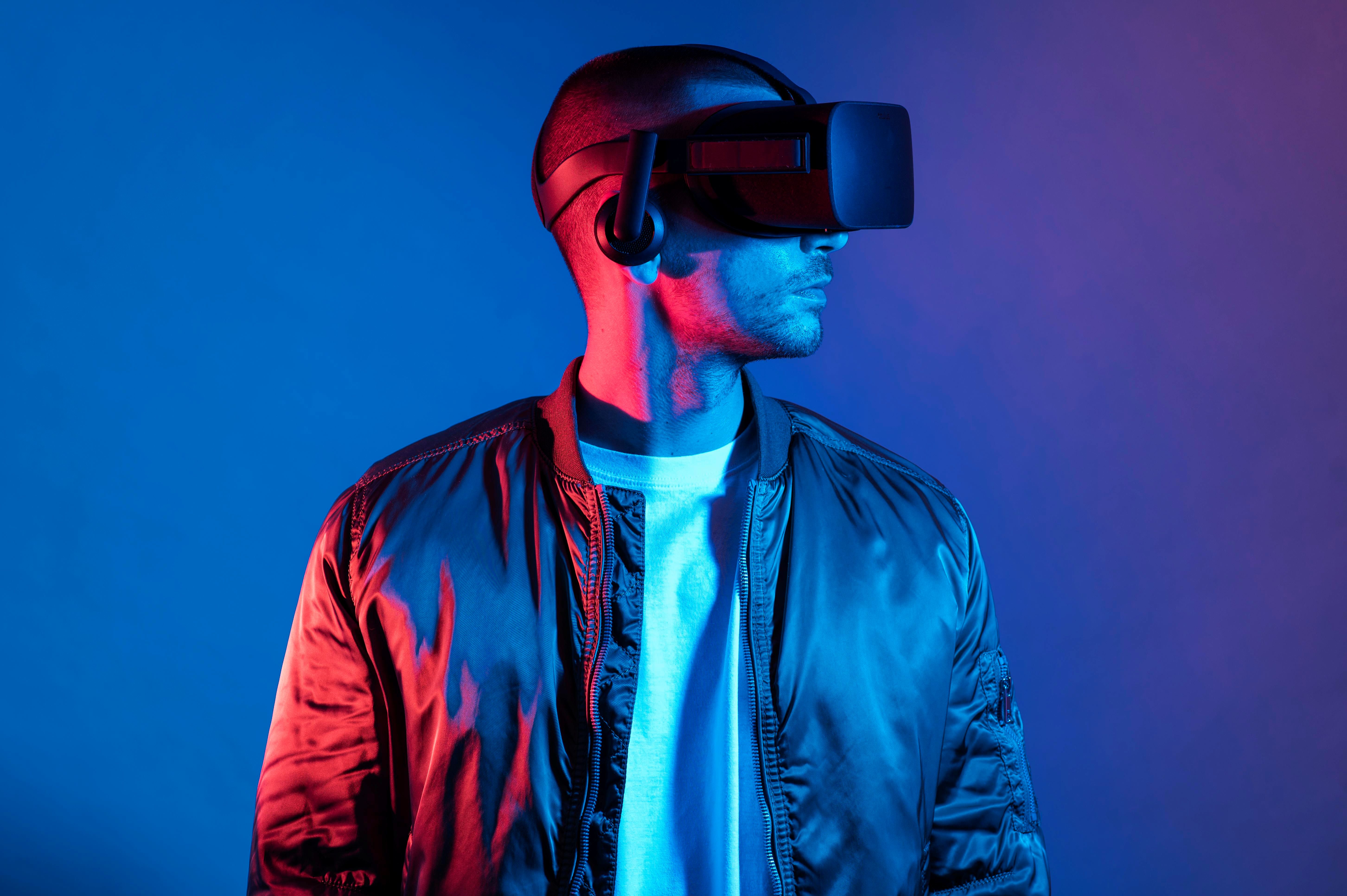 A man wearing a VR headset interacting with a lifelike AI avatar in a virtual training environment