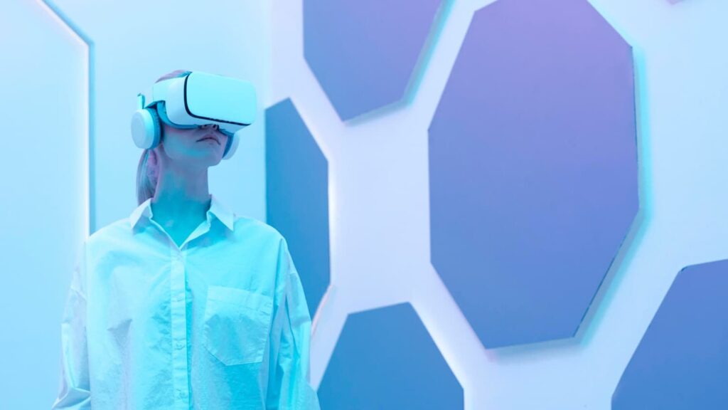 Woman in a white shirt using VR for digital transformation training.